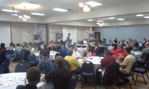 Colonel Mark Rathburn speaking to attendees